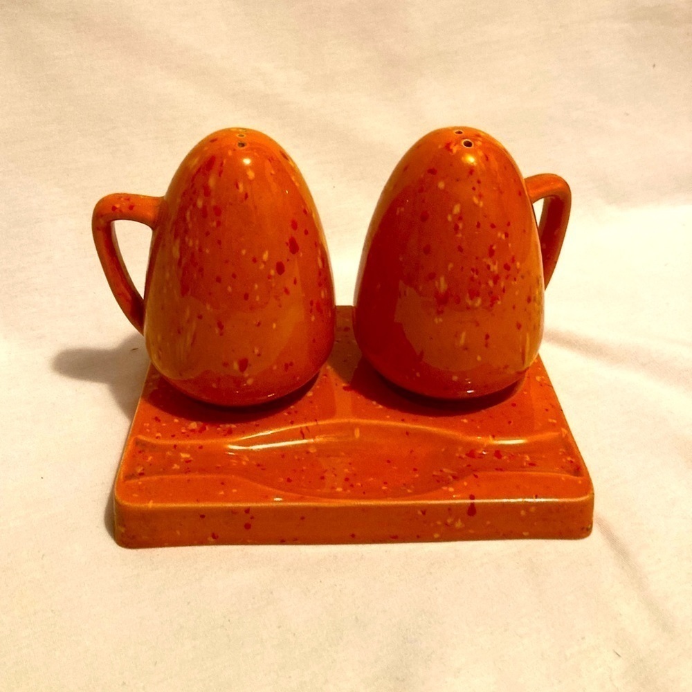 Orange speckled salt and pepper shakers with the tray vintage kitschy 70s BoHo